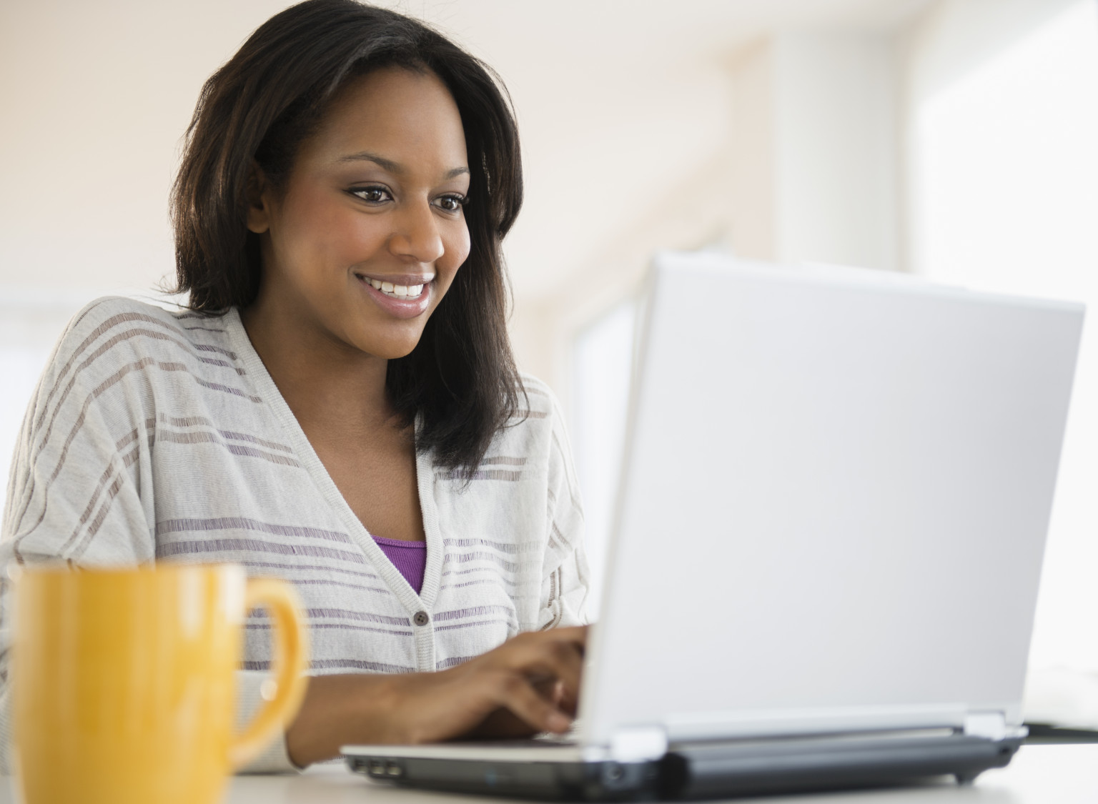 African American woman using laptop