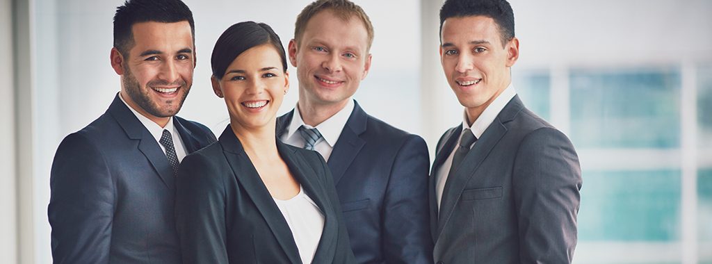 Portrait of happy business people looking at camera