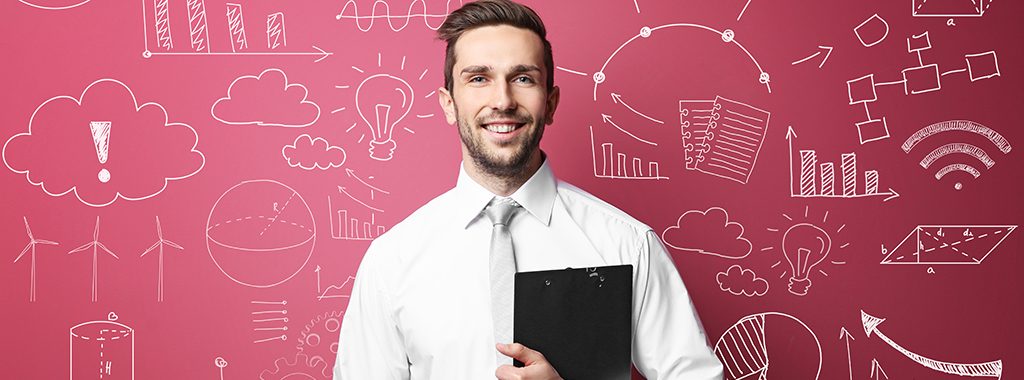 Smiling man standing in front of blackboard showing symbols related to science, math and business.