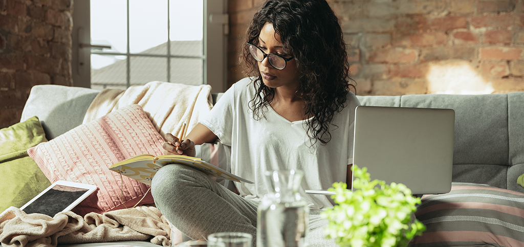 Working at home. Beautiful african american women, freelancer isolated. Remote working, freelance, being at home, staying safe while isolation or quarantine. Work and occupation, prevention concept.